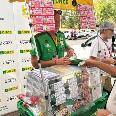 ONCE seller Gabriel Fernández at his stand in Vegas del Genil.