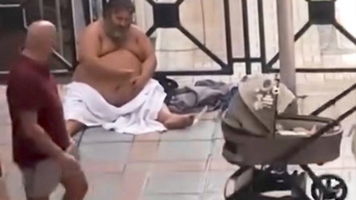 Naked man saying obscenities to passing women.
