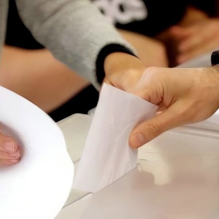Hand casting vote in local elections