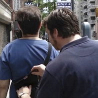 Man robbing rucksack of other