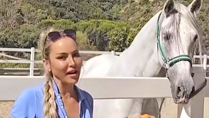 Victoria with one of the saved horses.