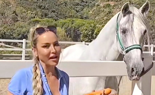 Victoria with one of the saved horses.