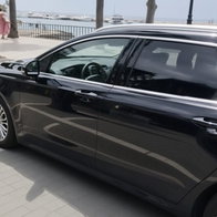 Uber taxi on Marbella sea front.