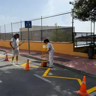 Workers putting finishing touches for school kids.