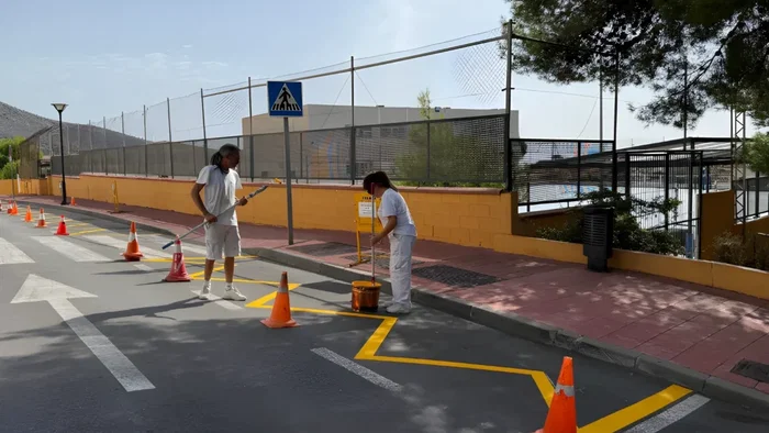 Workers putting finishing touches for school kids.