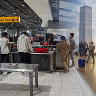Airport security point overlaid with twin tower image