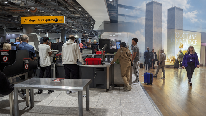 Airport security point overlaid with twin tower image