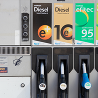 A Repsol petrol station pump with two diesel and two petrol nozzles, and a small display showing a litre price.