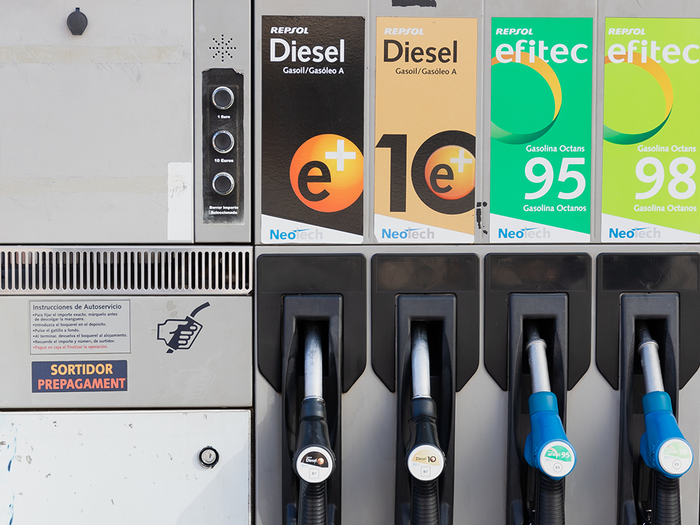 A Repsol petrol station pump with two diesel and two petrol nozzles, and a small display showing a litre price.