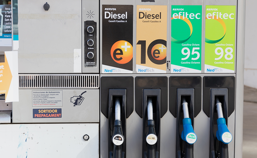 A Repsol petrol station pump with two diesel and two petrol nozzles, and a small display showing a litre price.