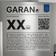 Close-up of the new EU GARAN guarantee label on a fridge door, showing the tick symbol, QR code and guarantee-length information in multiple languages.