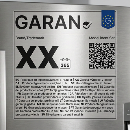 Close-up of the new EU GARAN guarantee label on a fridge door, showing the tick symbol, QR code and guarantee-length information in multiple languages.