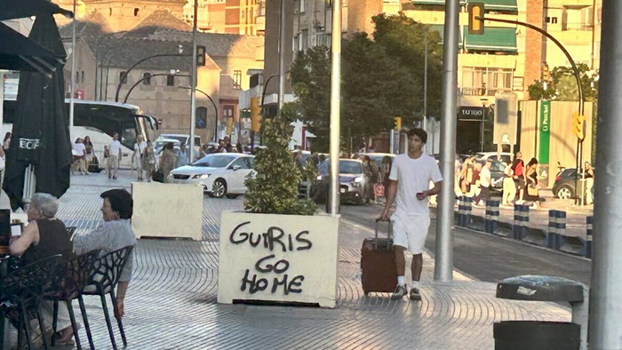 Graffiti appearing around Malaga reading "Guiris go home" following recent housing protests.