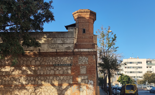 Side façade of the old Málaga prison building in a Málaga neighbourhood.