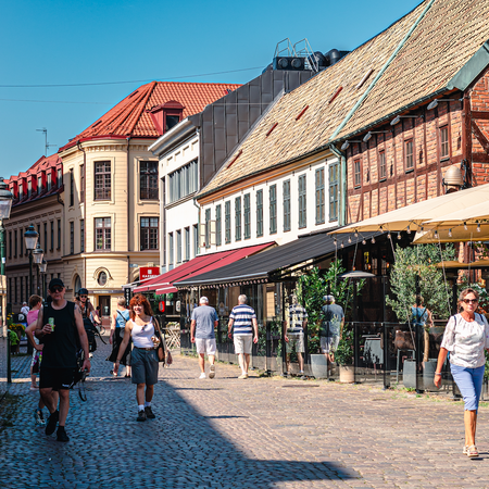 A street in Malmo, Sweden with passing residents and tourists