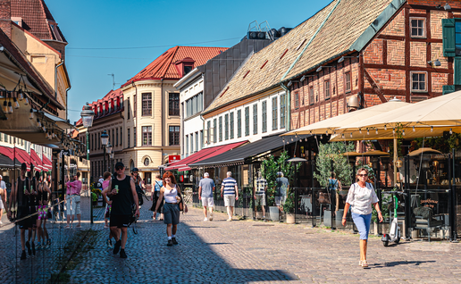 A street in Malmo, Sweden with passing residents and tourists