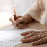 Signing a will.