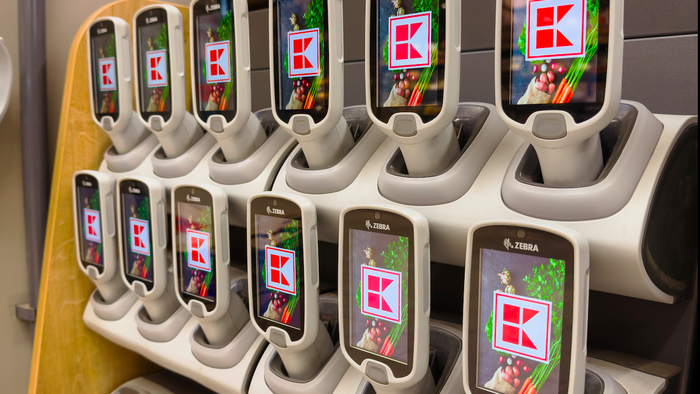 Hand scanners for a supermarket stocked placed in their holders