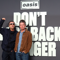 The Gallagher brothers that for the band Oasis behind a logo that reads ''Don't look back in anger''