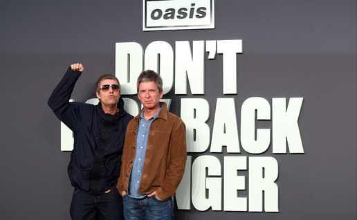 The Gallagher brothers that for the band Oasis behind a logo that reads ''Don't look back in anger''