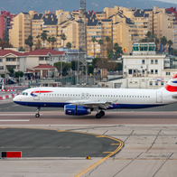 The runway at Gibraltar airport with a British Airways aircraft preparing to take off