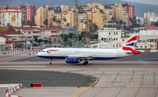 The runway at Gibraltar airport with a British Airways aircraft preparing to take off