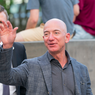 Jeff Bezos being accompanied by his bodyguard