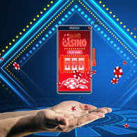 Online casino and gaming, gambling on device concept. Close up of male hands holding smartphone with creative slot machine and other games