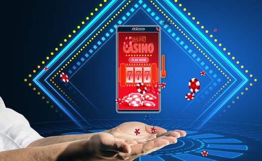 Online casino and gaming, gambling on device concept. Close up of male hands holding smartphone with creative slot machine and other games