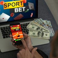 Man watching football play online broadcast on his laptop, cheering for his favourite team, making bets at bookmaker's website