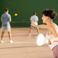 Woman playing Basque Pelota on an outdoor court