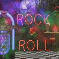 Jukebox in a bar with neon sign Rock n Roll with rainy window