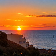Sunset over the Spanish Mediterranean coast as autumn begins and daylight hours become shorter.