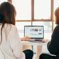 Two women working.