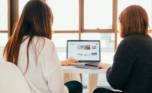 Two women working.