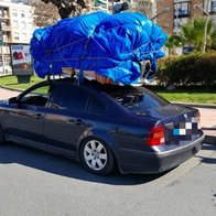 Car with Overloaded roof rack.