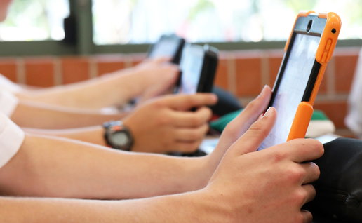 High school students using tablets in class