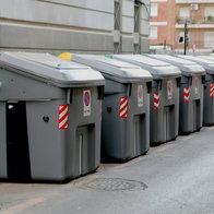 A line of rubbish containers in a street in Cartagena, Murcia
