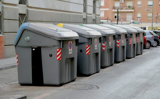 A line of rubbish containers in a street in Cartagena, Murcia