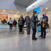 A queue at a reception desk at a health centre in Spain