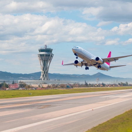 White aircraft coming into land at Barcelona El-Prat Airport