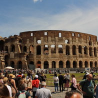 The colosseum surrounded by tourists