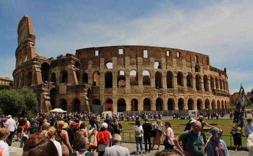 The colosseum surrounded by tourists