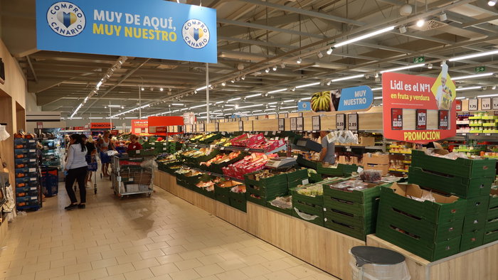 Inside of a supermarket in the fruit and vegetable aisle