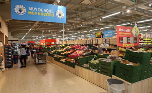 Inside of a supermarket in the fruit and vegetable aisle