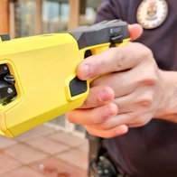 Local police carrying taser electronic pistols.