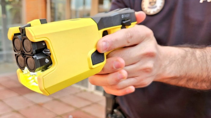 Local police carrying taser electronic pistols.