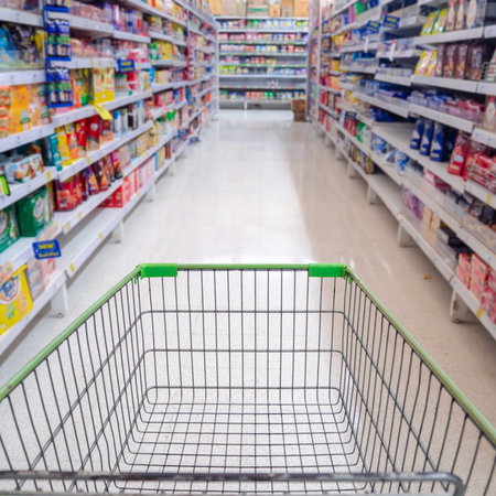 Empty shopping trolley in a supermarket aisle ahead of Spain's 24-hour shopping boycott