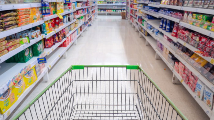 Empty shopping trolley in a supermarket aisle ahead of Spain's 24-hour shopping boycott