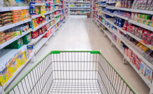 Empty shopping trolley in a supermarket aisle ahead of Spain's 24-hour shopping boycott